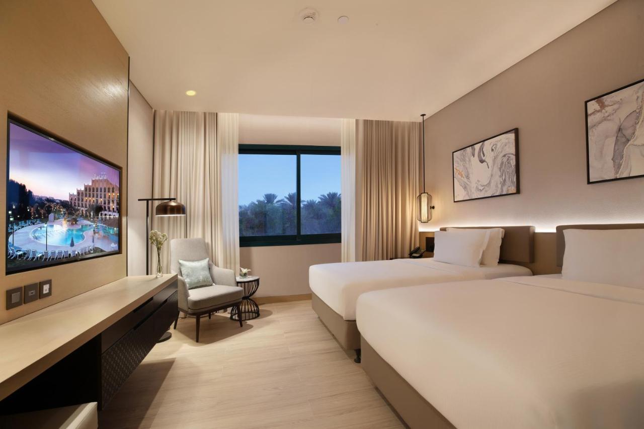 Al Ain Rotana Hotel Exterior photo Deluxe Room