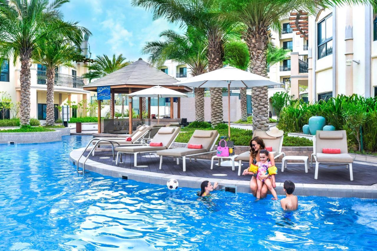 Al Ain Rotana Hotel Exterior photo The swimming pool at the resort